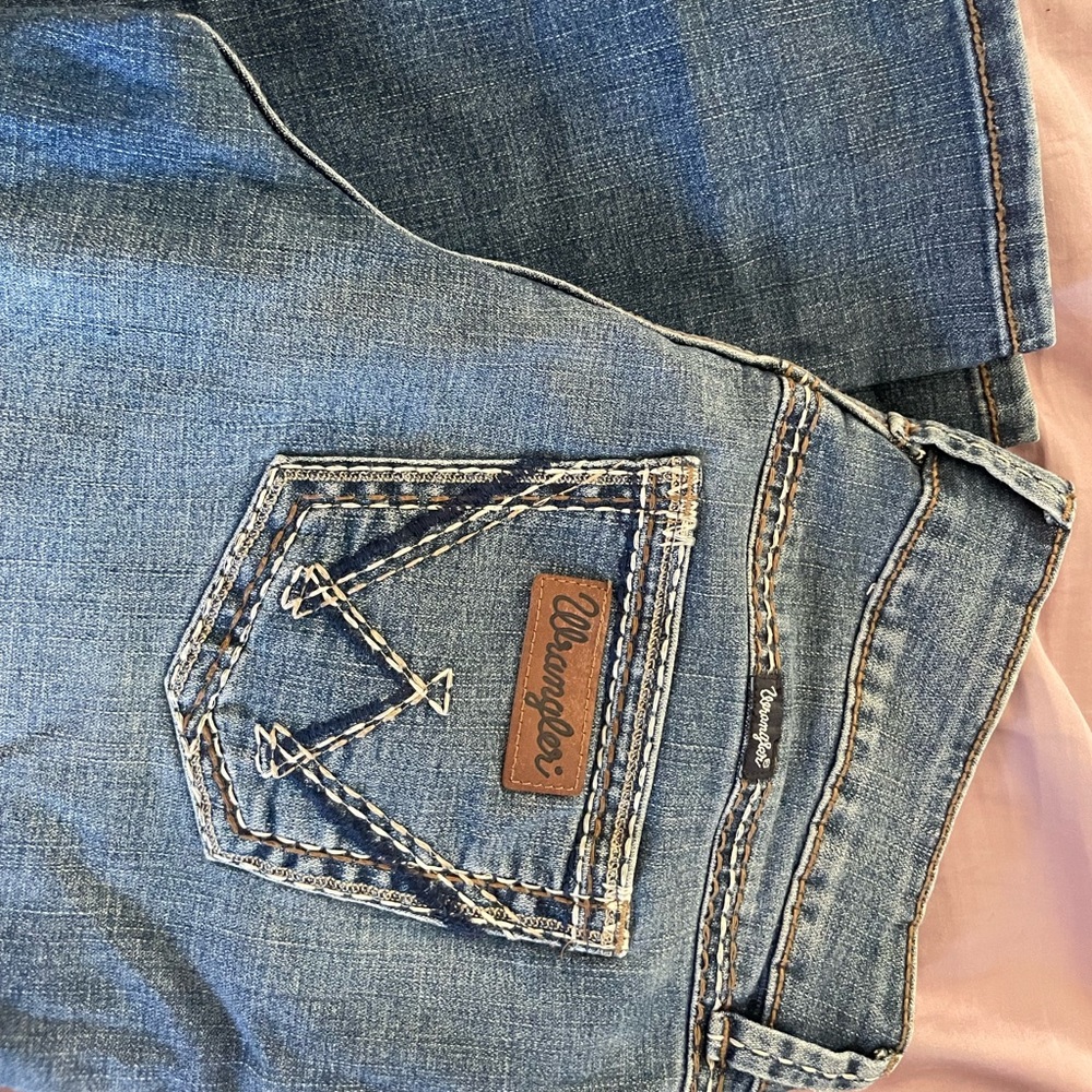 Women’s mid rise wrangler boot cut jeans